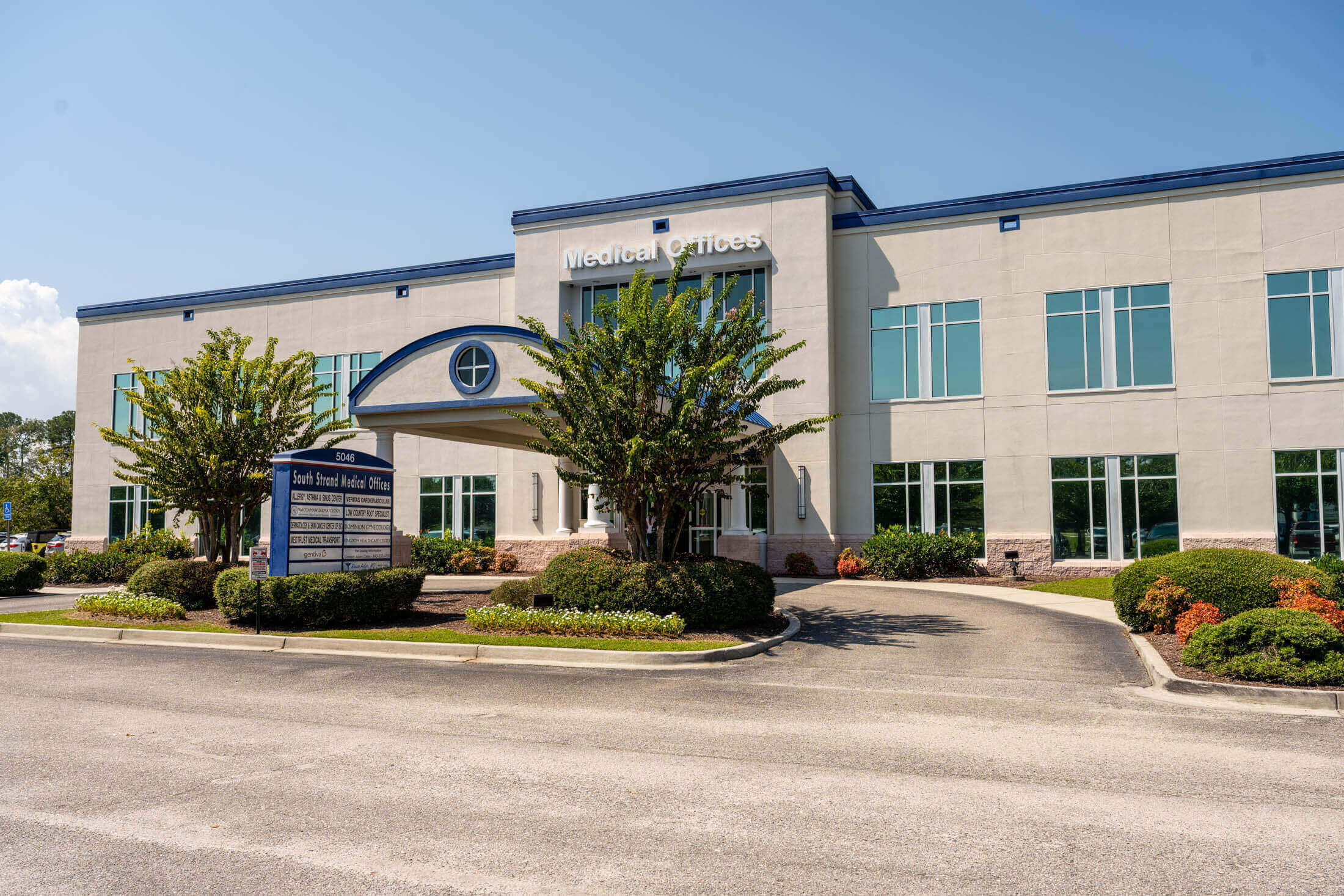 Medical office building with entrance and sign.